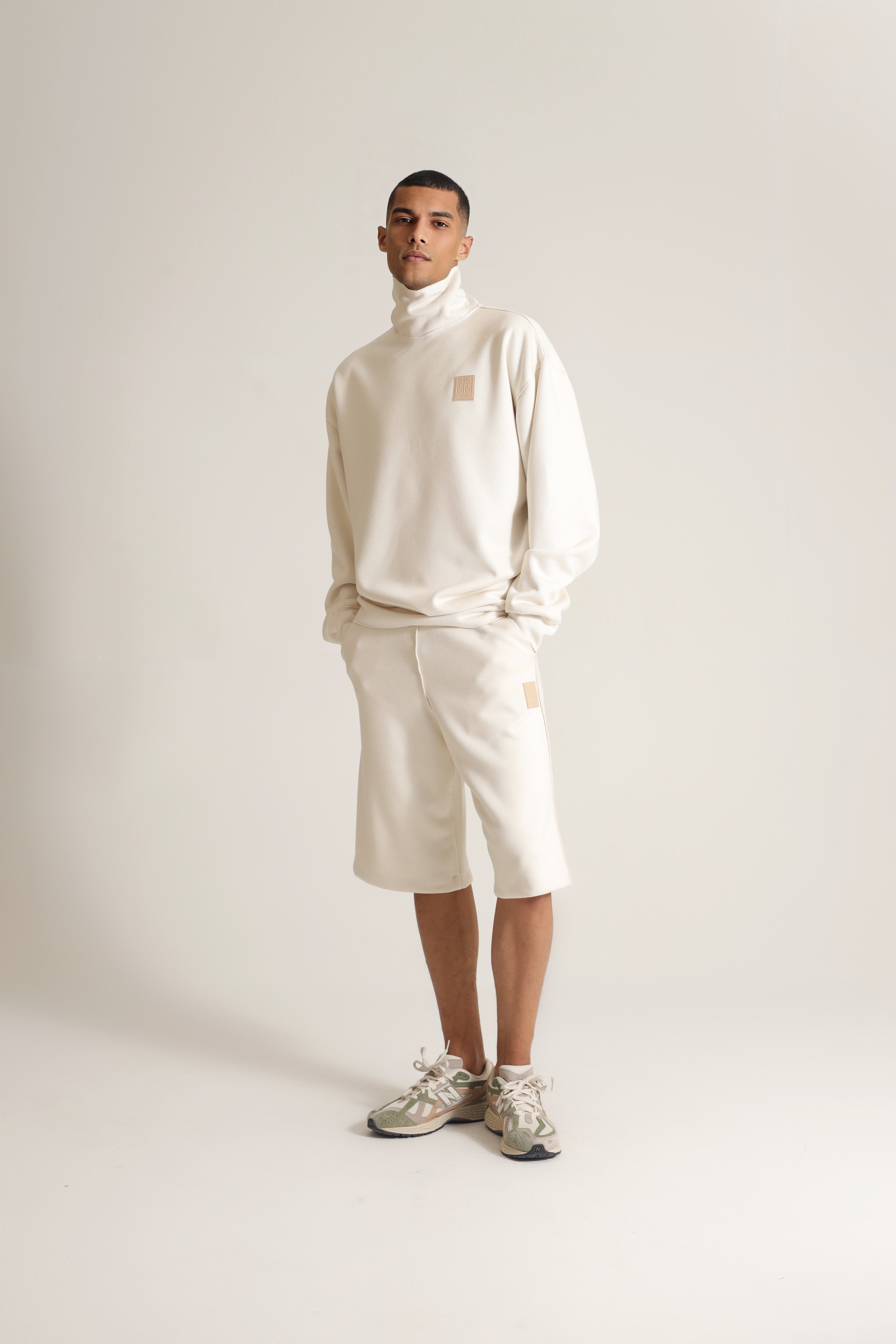 HIGH NECK SWEATER LOGO PATCH IN BEIGE