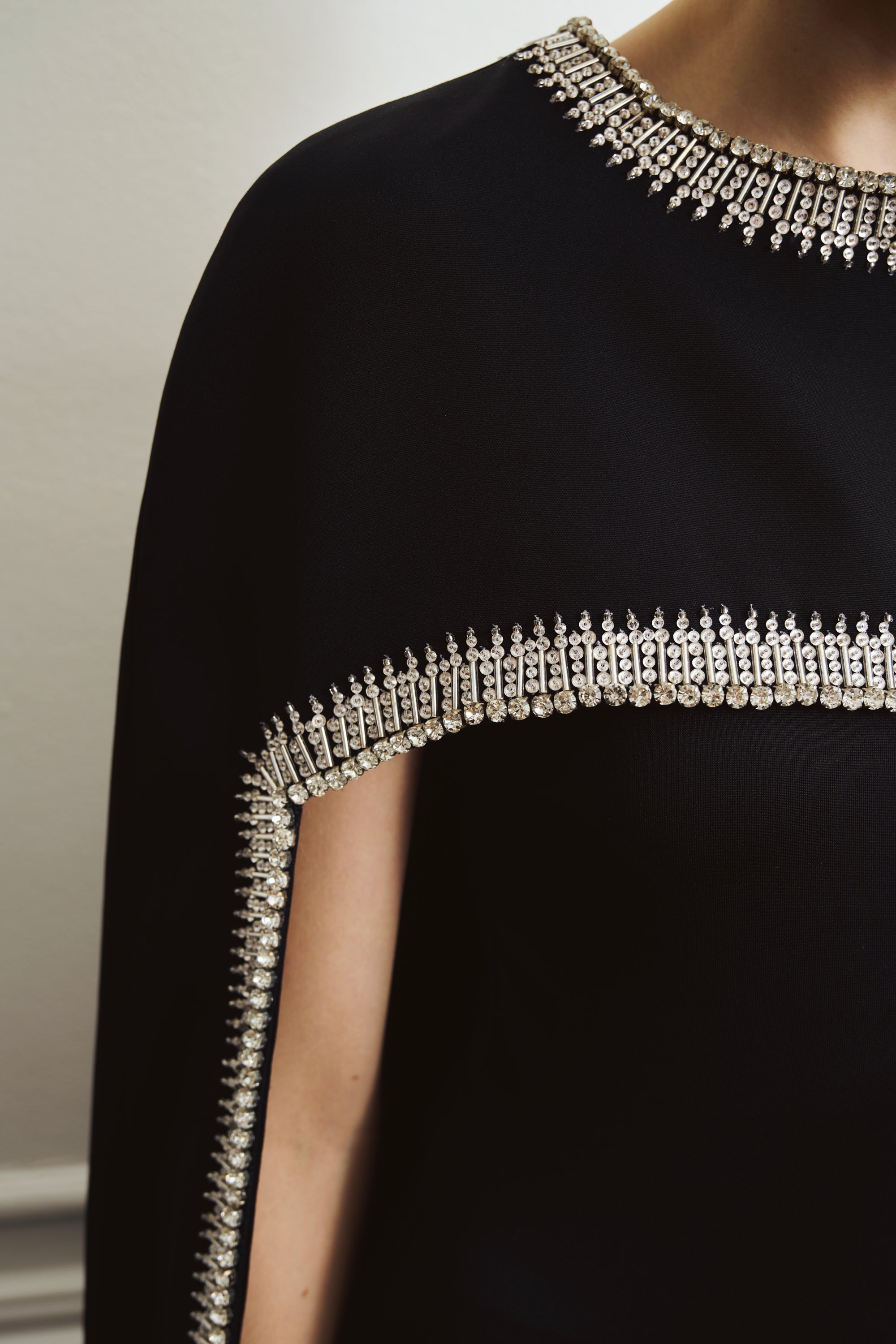 Short black cape adorned with crystals